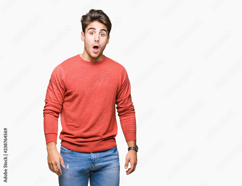 Fototapeta premium Young handsome man over isolated background In shock face, looking skeptical and sarcastic, surprised with open mouth