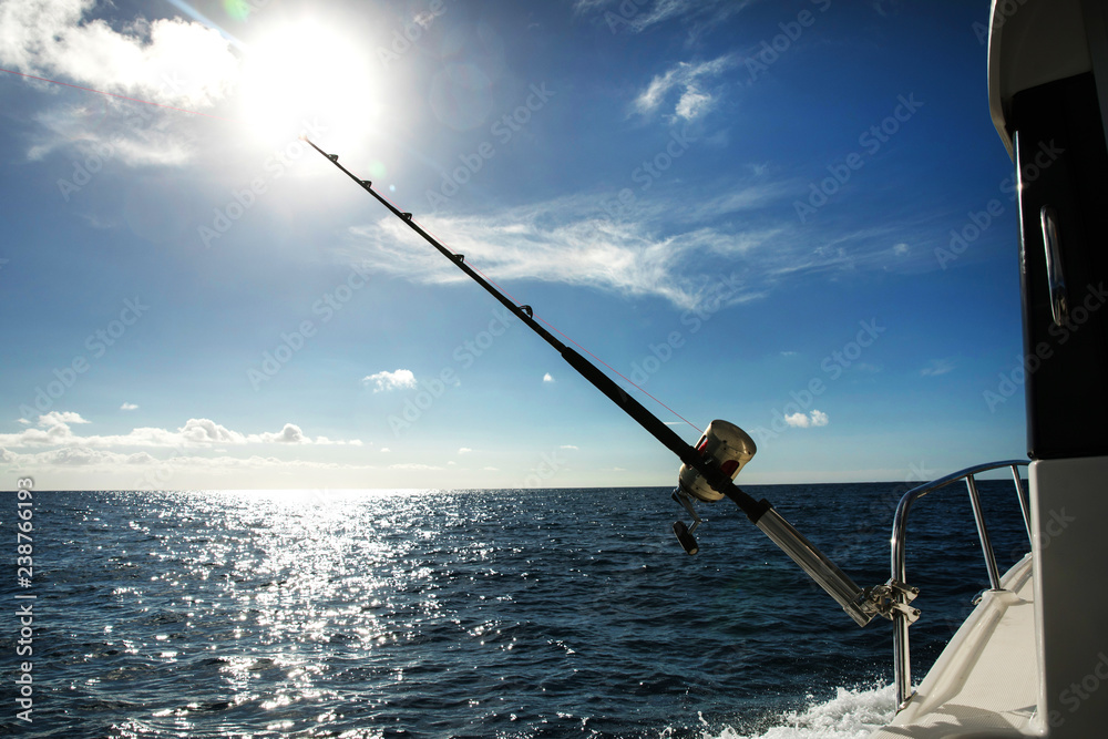 fishing rod over blue sea