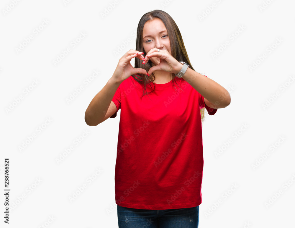 Young beautiful caucasian woman over isolated background smiling in love showing heart symbol and shape with hands. Romantic concept. Young beautiful caucasian woman over isolated background smiling in love showing heart symbol and shape with hands. Romantic concept.