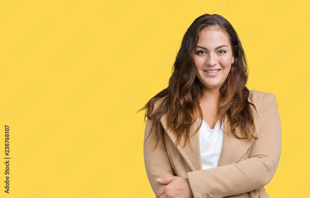 Beautiful plus size young woman wearing winter coat over isolated background happy face smiling with crossed arms looking at the camera. Positive person. Beautiful plus size young woman wearing winter coat over isolated background happy face smiling with crossed arms looking at the camera. Positive person.