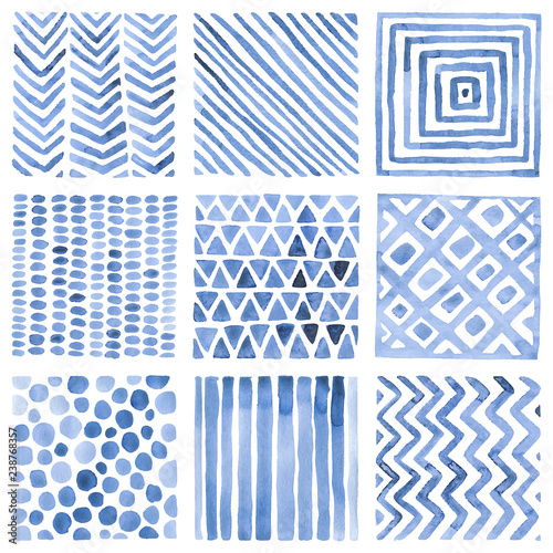 Set of watercolor patterns. Blue ornaments on a white background. Handwork.