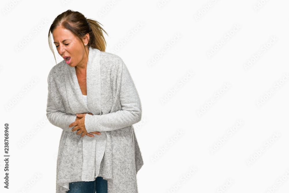 Beautiful middle age adult woman wearing winter sweater over isolated background with hand on stomach because nausea, painful disease feeling unwell. Ache concept. Beautiful middle age adult woman wearing winter sweater over isolated background with hand on stomach because nausea, painful disease feeling unwell. Ache concept.