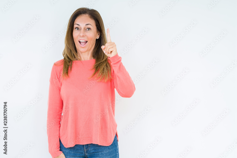 Beautiful middle age woman over isolated background pointing finger up with successful idea. Exited and happy. Number one. Beautiful middle age woman over isolated background pointing finger up with successful idea. Exited and happy. Number one.