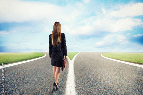 Choices of a businesswoman at a crossroads. Concept of decision photo
