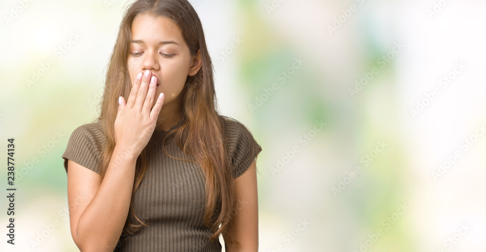 Young beautiful brunette woman over isolated background bored yawning tired covering mouth with hand. Restless and sleepiness. Young beautiful brunette woman over isolated background bored yawning tired covering mouth with hand. Restless and sleepiness.