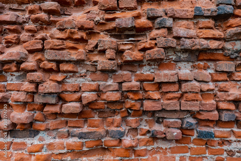 Naklejka premium Texture pattern of an old medieval brick wall