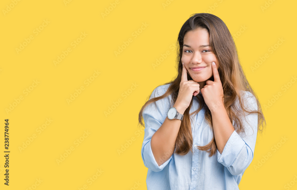 Young beautiful brunette business woman over isolated background Smiling with open mouth, fingers pointing and forcing cheerful smile Young beautiful brunette business woman over isolated background Smiling with open mouth, fingers pointing and forcing cheerful smile