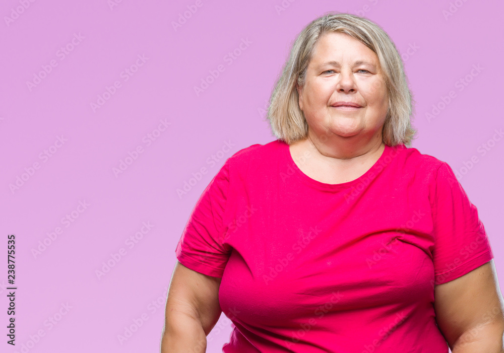 Senior plus size caucasian woman over isolated background with serious expression on face. Simple and natural looking at the camera. Senior plus size caucasian woman over isolated background with serious expression on face. Simple and natural looking at the camera.