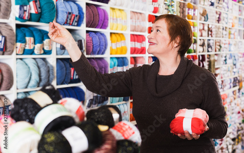 Mature customer in yarn shop photo