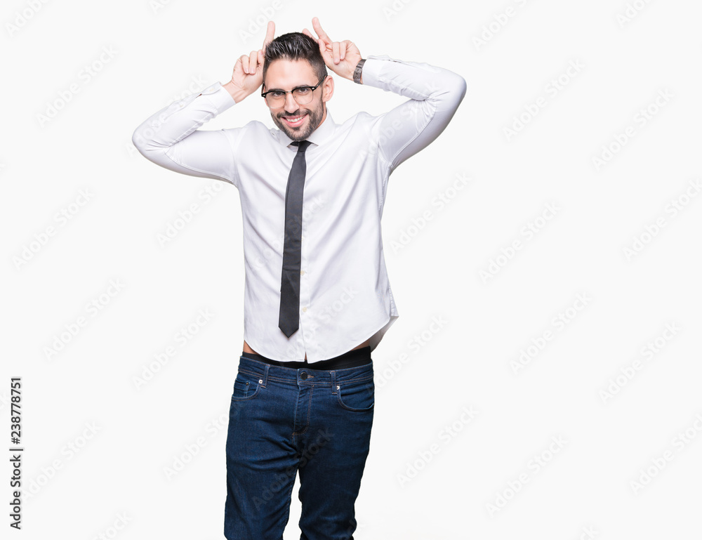 Young handsome business man wearing glasses over isolated background Posing funny and crazy with fingers on head as bunny ears, smiling cheerful Young handsome business man wearing glasses over isolated background Posing funny and crazy with fingers on head as bunny ears, smiling cheerful