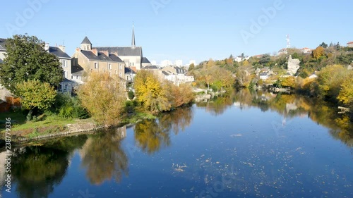 Poitiers is a city on the Clain river in west-central France. It is a commune and the capital of the Vienne department and also of the Poitou. Landscape. View on the river. Blue sky.