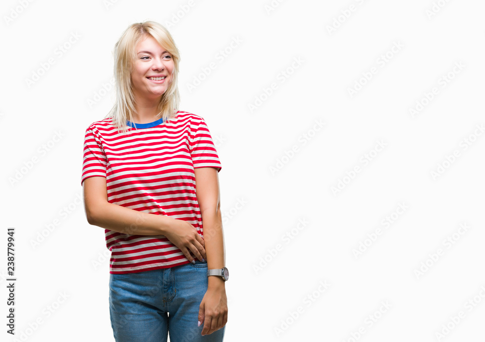 Young beautiful blonde woman over isolated background looking away to side with smile on face, natural expression. Laughing confident. Young beautiful blonde woman over isolated background looking away to side with smile on face, natural expression. Laughing confident.