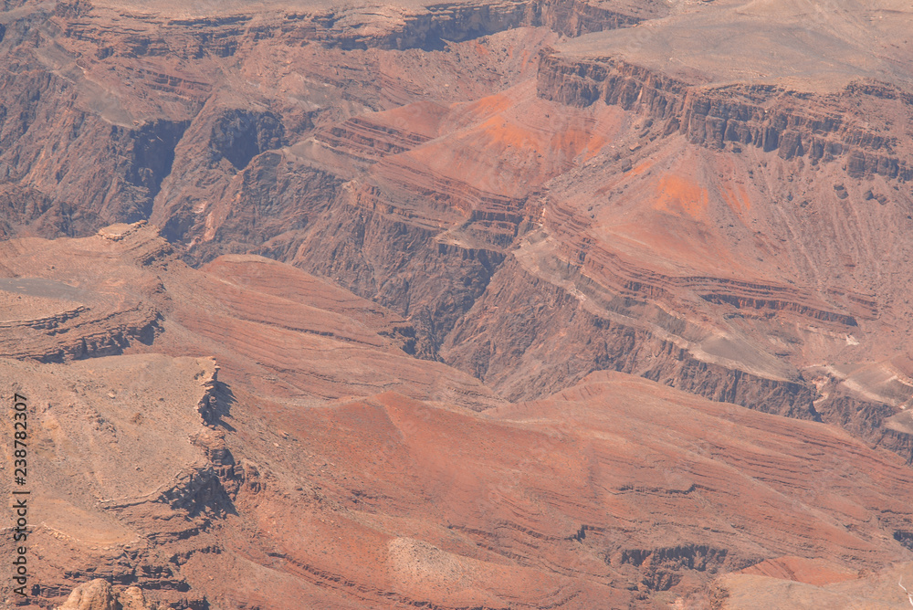 Closeup view on red rocks of Grand Canyon on sunny day Closeup view on red rocks of Grand Canyon on sunny day