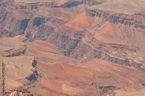 Closeup view on red rocks of Grand Canyon on sunny day © Hairem