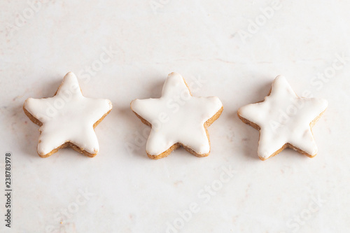 Batch of Star Shaped Gingerbread Cookies with White Icing photo