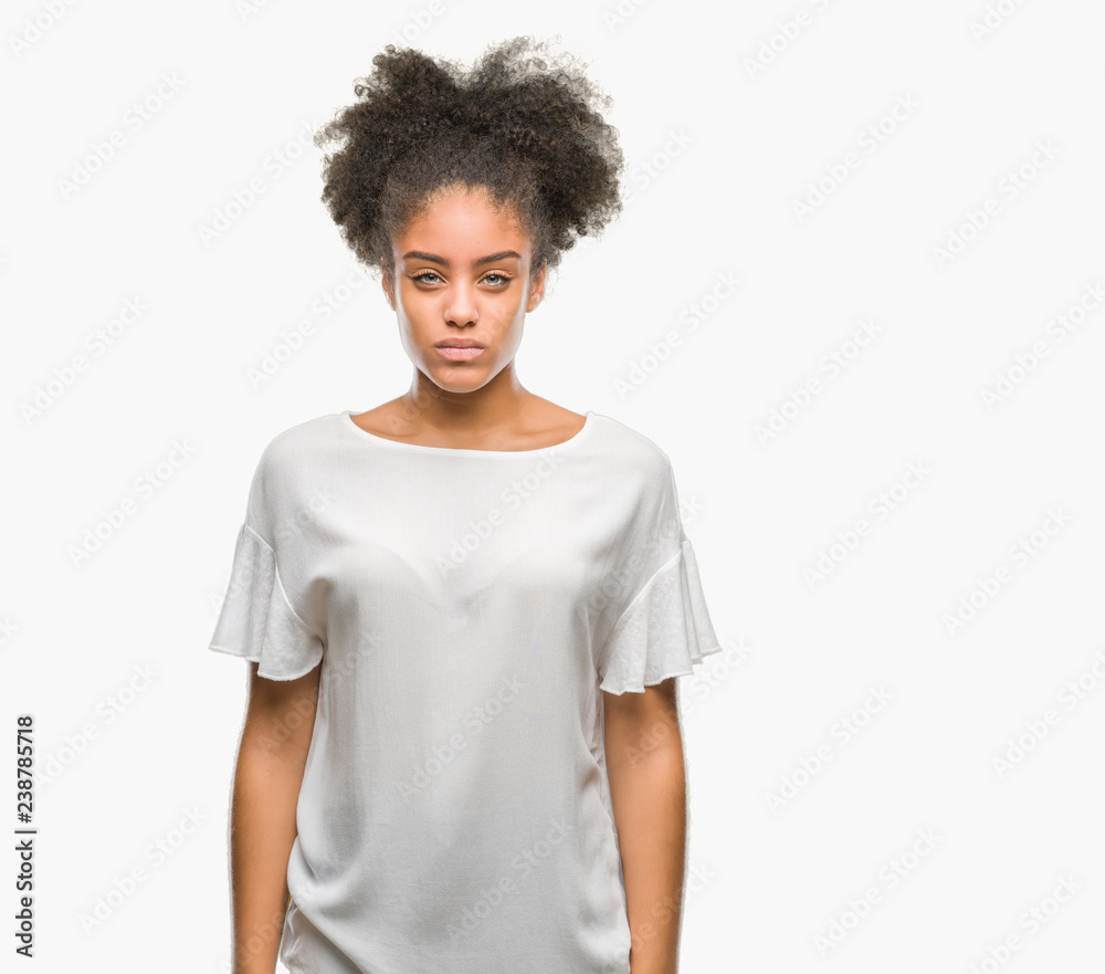 Young afro american woman over isolated background skeptic and nervous, frowning upset because of problem. Negative person. Young afro american woman over isolated background skeptic and nervous, frowning upset because of problem. Negative person.