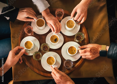 Group of people drinking turkish coffey, top view photo
