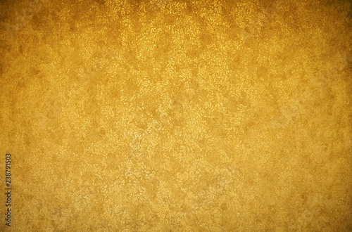 Gold background texture. Wallpaper on the wall. Element of design.