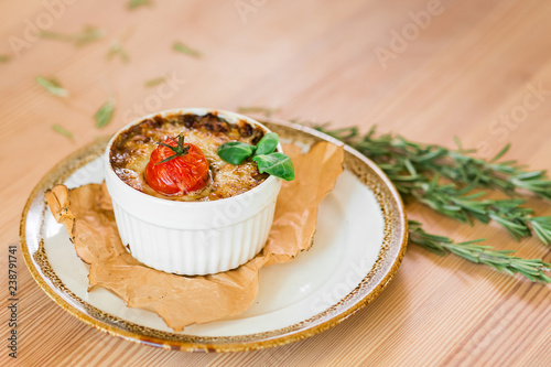 Julienne with mushrooms, cooked tomato cherry, cheese and rosemary