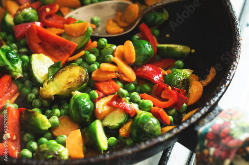 Vegetarian food fried vegetables, brussels sprouts and carrots