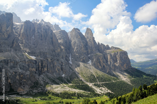 Summer in Dolomites valley with mountains roads and villages