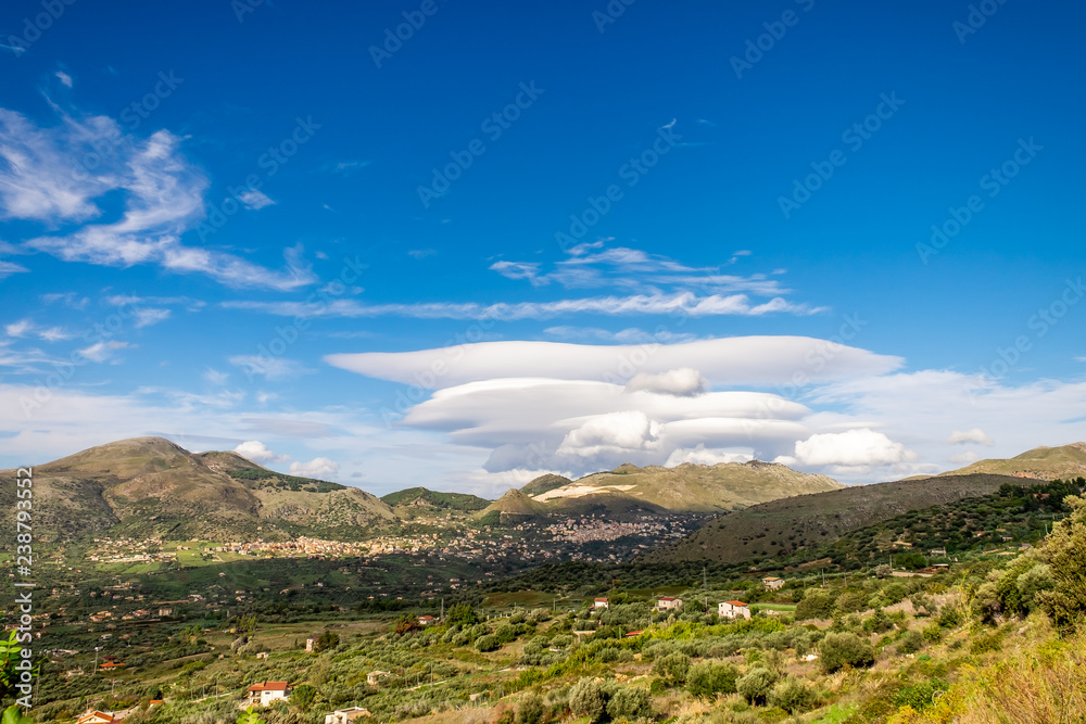 Lenticular clouds under the Mount Etna. Catania. Sicily. Lenticular clouds under the Mount Etna. Catania. Sicily.