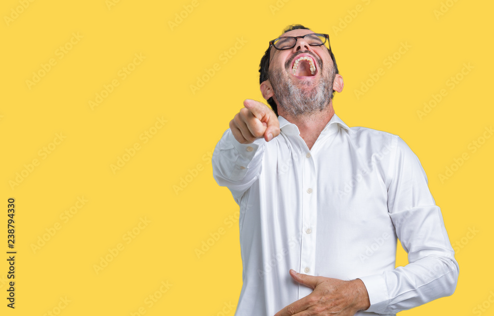 Handsome middle age elegant senior business man wearing glasses over isolated background Laughing of you, pointing to the camera with finger hand over chest, shame expression Handsome middle age elegant senior business man wearing glasses over isolated background Laughing of you, pointing to the camera with finger hand over chest, shame expression
