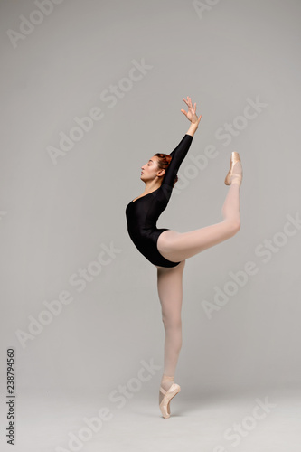 Elegant ballerina dancing in the studio. Young ballet dancer.