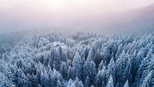 Snowboarder on the summit . Extreme sport. Snowboarder on mountain top. Freeride scene, Aerial view on top of a mountain. Ski resort. Carpathians mountains landscape. Winter sports. Freeride slope