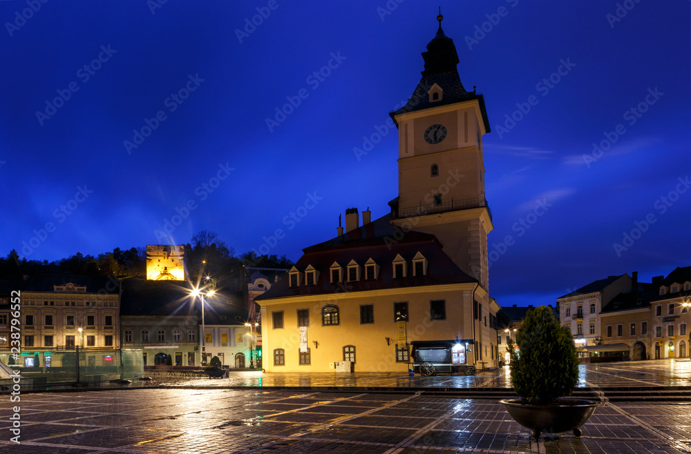 The Council Square during rain in Brasov, Romania. View with fam