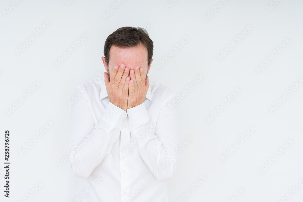 Elegant senior man over isolated background with sad expression covering face with hands while crying. Depression concept. Elegant senior man over isolated background with sad expression covering face with hands while crying. Depression concept.