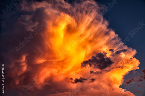Beautiful sunlit orange clouds piled high