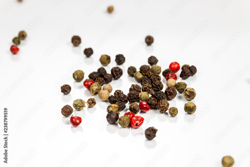 Pepper beans isolated on reflective white surface Pepper beans isolated on reflective white surface