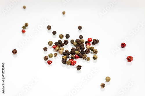Pepper beans isolated on reflective white surface