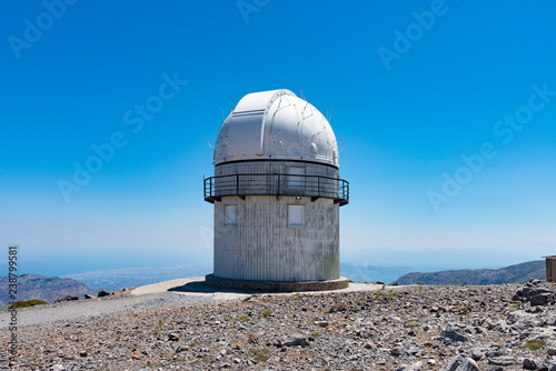 Mount Skinakas Peak astronomical observatory dome overlooking Heraklion city coastline, Crete, Greece. Sky astrophysical observatory at 2000m on Psiloritis mountain range. Astronomy concept. photo