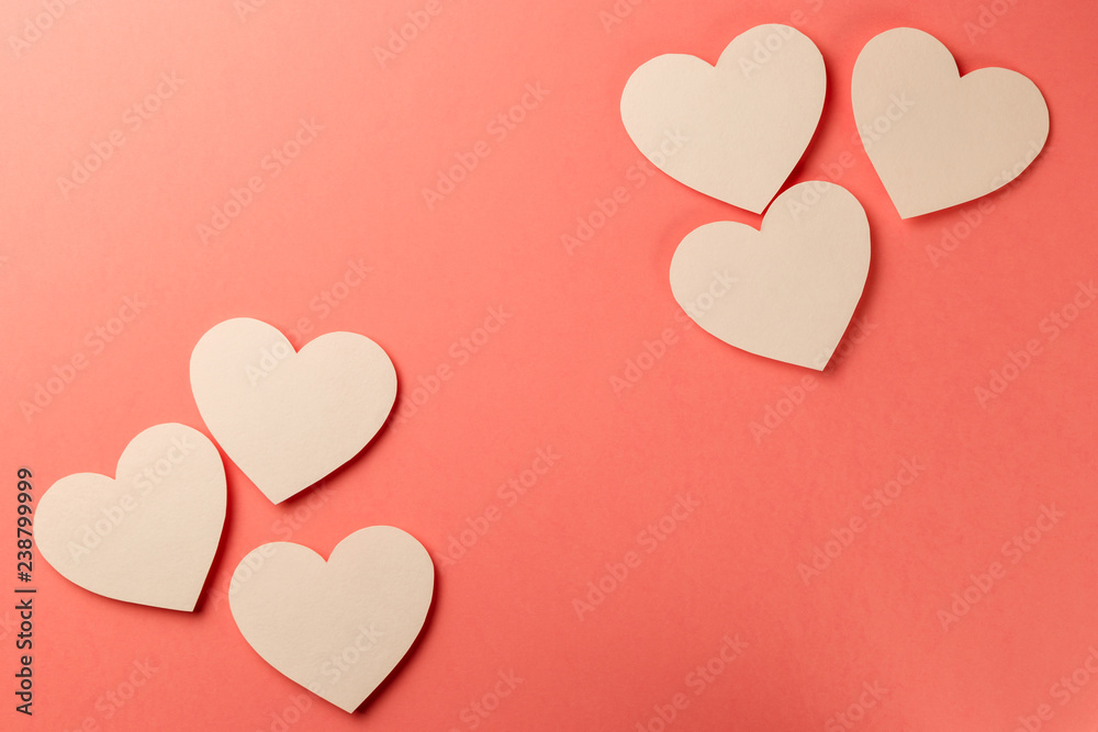Valentine's Day postcard. Valentine's Day Background. Heart on coral background. Copy space. Top view. Flat lay. Pastel colors. Living Coral color of the Year 2019
