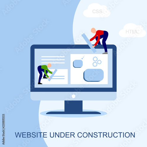 Website under construction. Two of young professionals working on a web page. Web development. 
