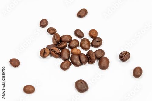 Roasted coffee beans isolated on white background, angle view