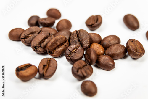 Roasted coffee beans isolated on white background  angle view