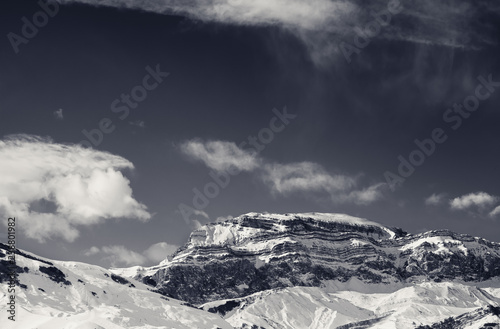 Rocky mountains in snow at sun winter day © BSANI