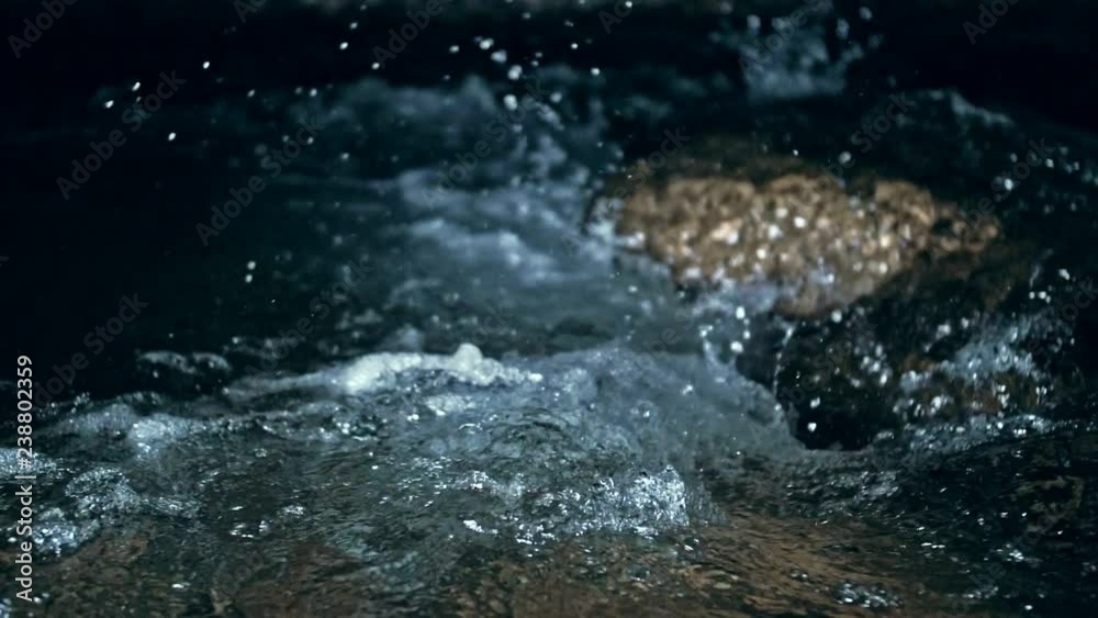 Slow motion of waves on dark water surface with play of flecks of bright light close up. Amazing dramatic natural background. Shooting with 180fps. Epic mystical and magic night view. Crystal clear Slow motion of waves on dark water surface with play of flecks of bright light close up. Amazing dramatic natural background. Shooting with 180fps. Epic mystical and magic night view. Crystal clear