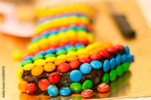 Birthday cake covered colourful candies 