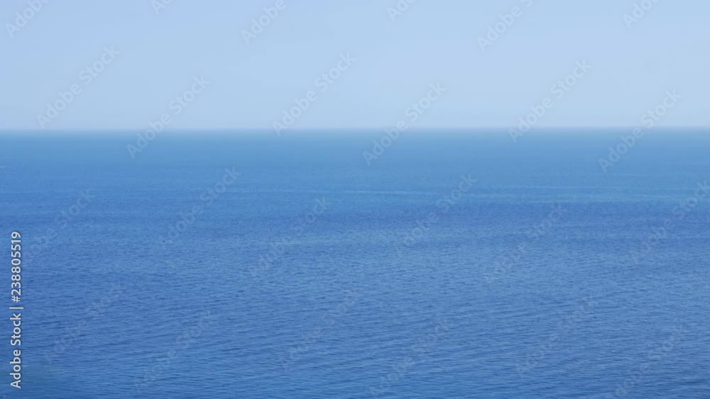 High angle view of blue, mediterranean ocean. Taormina, Sicily, Italy. High angle view of blue, mediterranean ocean. Taormina, Sicily, Italy.
