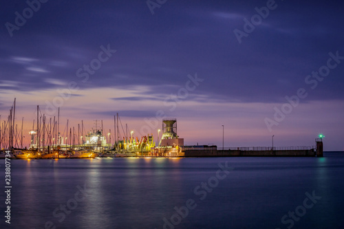 Yacht port of Cuxhaven Germany with night lights on at sunset. 