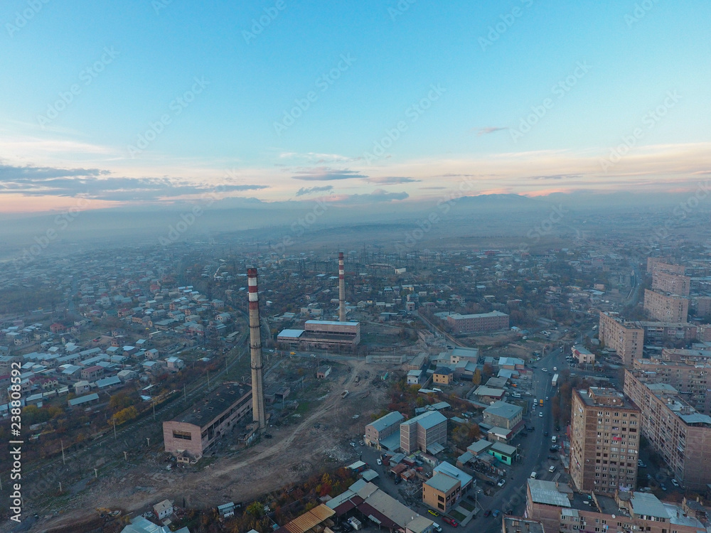 Fototapeta premium Arial view of Yerevan city buildings under blue sky, Armenia