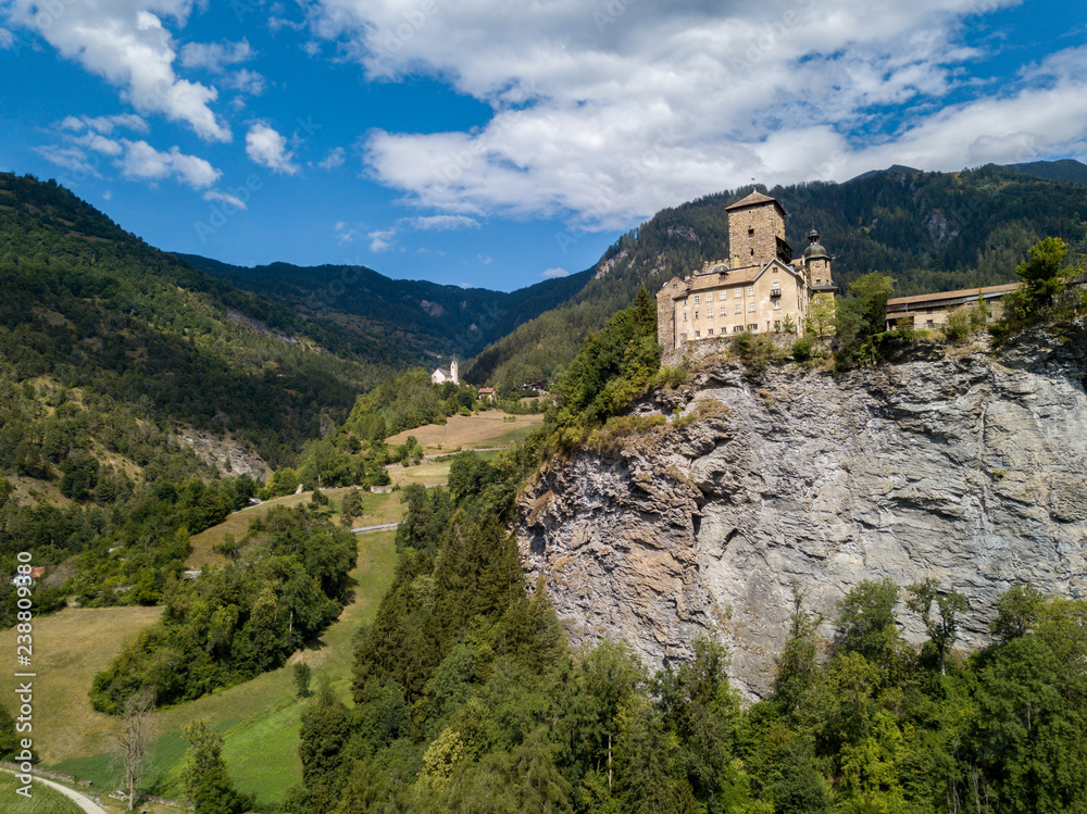 Ortenstein Castle (build in 1250) near the Swiss village Domleschg in Canton Graubuenden, Switzerland - aerial photography Ortenstein Castle (build in 1250) near the Swiss village Domleschg in Canton Graubuenden, Switzerland - aerial photography