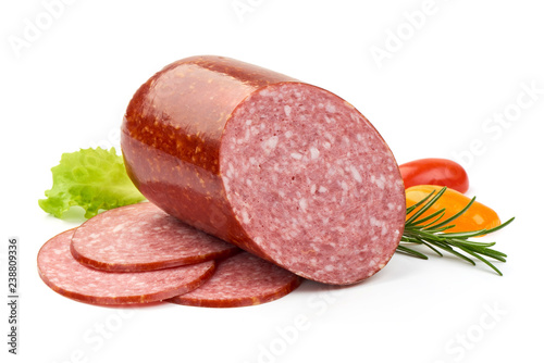 Cold Salami with slices, herbs and tomatoes, isolated on a white background. Close-up