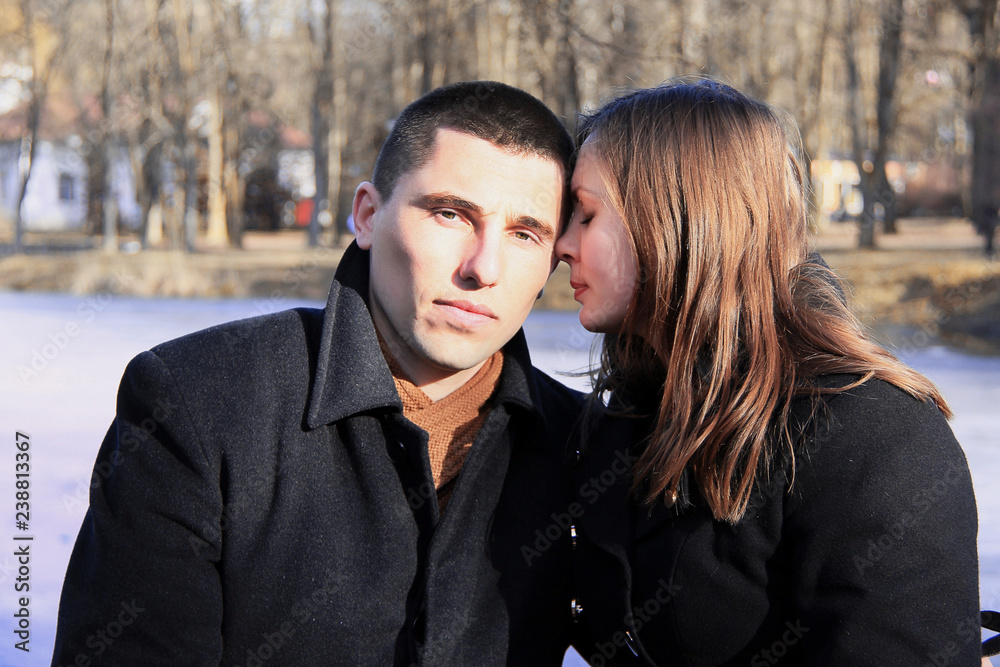 Happy couple in the city park on Valentine's day Happy couple in the city park on Valentine's day