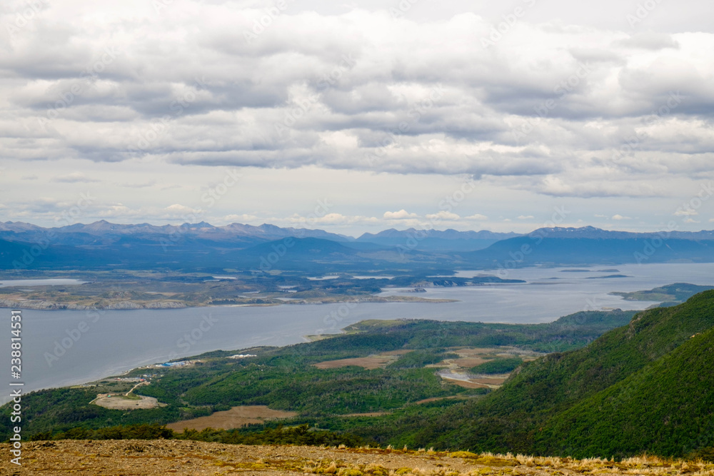 Landscape with forest, Beagle Channel and isolated houses as seen from Cerro Bandera, Puerto Williams, Chile