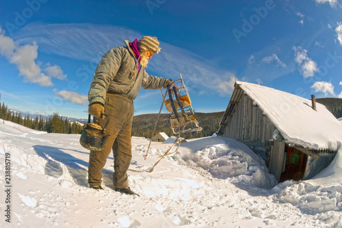 old traveler in the mountains photo